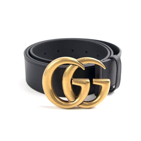 black gucci belt with gold buckle.